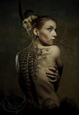 The biomechanic corset tattoo inspired by HR Giger artworks, Author: Sebastian Żmijewski, Model: Milena Żmijewska, Bloody Art, Sieradz Poland