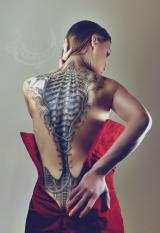 The biomechanic corset tattoo inspired by HR Giger artworks, Author: Sebastian Żmijewski, Model: Milena Żmijewska, Photo: Ulvhedinn & Fantasmica