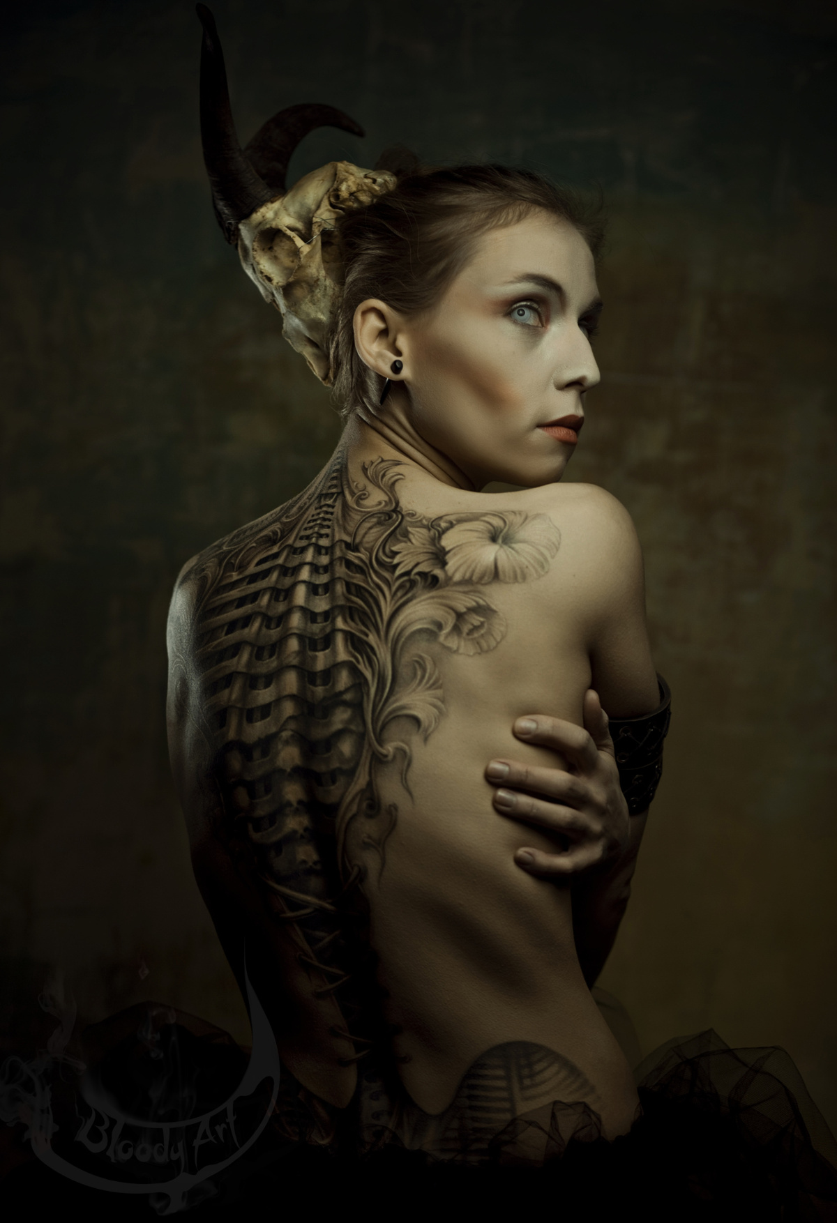 The biomechanic corset tattoo inspired by HR Giger artworks, Author: Sebastian Żmijewski, Model: Milena Żmijewska